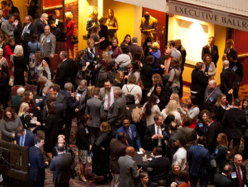 Hundreds of AFP members and guests mingling in the hotel lobby before the start of the National Philanthropy Day event in 2018