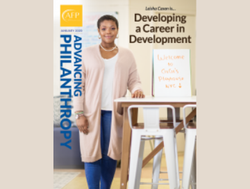 Cover of April 2020 edition with young black woman standing in office "Developing a Career in Development"