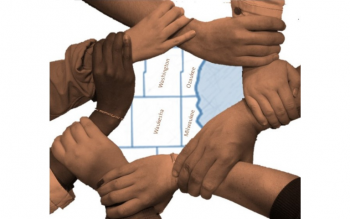 Hands holding wrists to form a circle around county map of southeastern Wisconsin