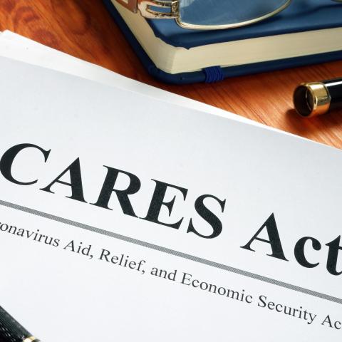"CARES Act" document with pen