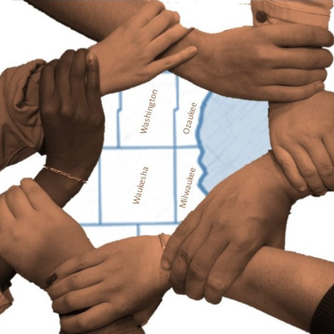 Hands holding wrists to form a circle overlaying an image of Milwaukee and surrounding counties