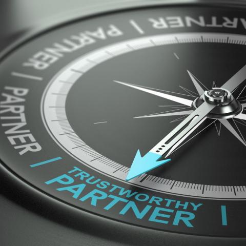 compass with arrow pointed to "trustworthy partner"