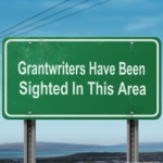 Street sign that says "Grantwriters Have Been Sighted In This Area"