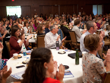 Attendees applauding during FDW 2018 conference opening session