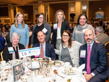 Children's Wisconsin staff posing at their luncheon table