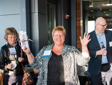 Lisa Breitsprecker making announcements at the 2019 membership social hour.