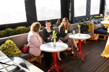 Photo of Rikki and two other AFP members visiting at AFP social hour