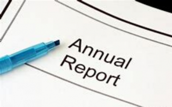 Document with pen laying on it that says "Annual Report"