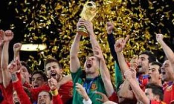 Image of team captain Iker Casillas and Spain's National Soccer Team holding trophy in celebration of winning the 2010 World Cu