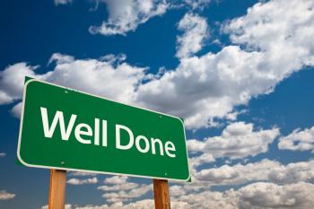 "Well Done" sign with blue sky behind
