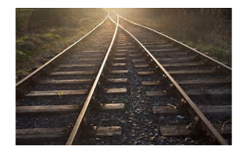 image of two sets of train tracks merging into one