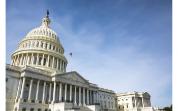 image of US Capitol Building with blue sky in the background