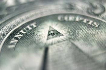 Close-up image of the pyramid with an eye on the US dollar bill