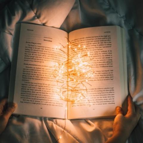 Book open on bed