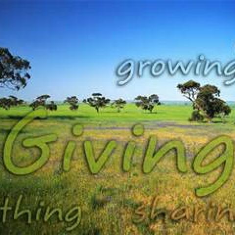 "Giving" with photo of a prairie and blue sky in the background