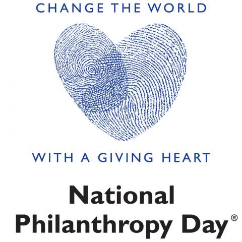 "Change the World With a Giving Heart" National Philanthropy Day logo with thumbprints in the shape of a heart
