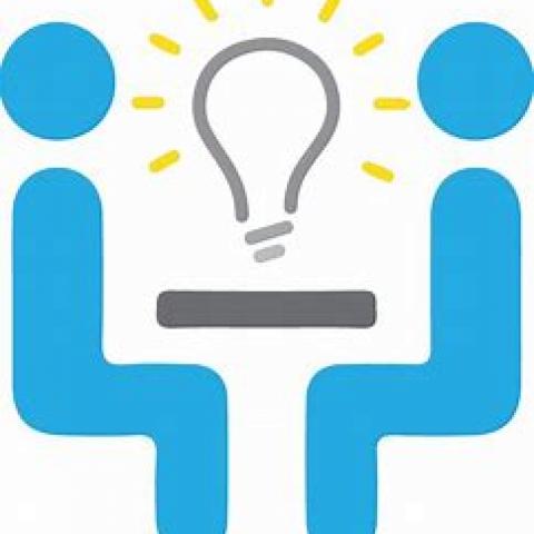 graphic designed image of two figures sitting at a table with a light bulb in the middle
