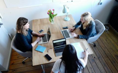 professionals around a table in discussions