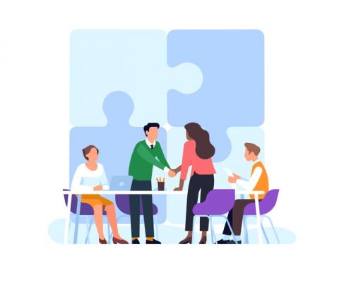 Partnerships - shaking hands across the table as puzzle pieces come together