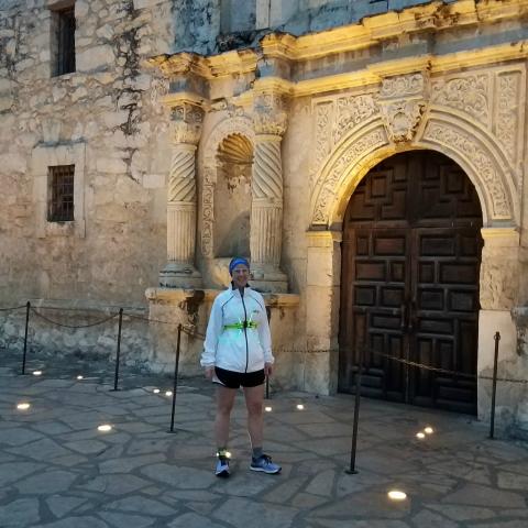 Photo of Amy Rowell in front of The Alamo near San Antonio, Texas