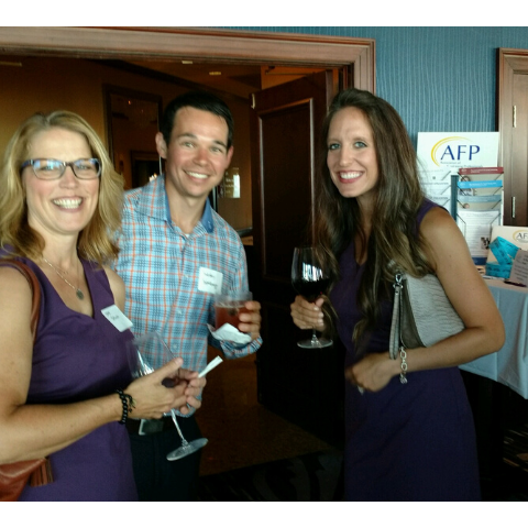 Three AFP members with wine posing for a picture