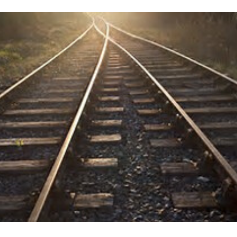 image of two sets of train tracks merging into one