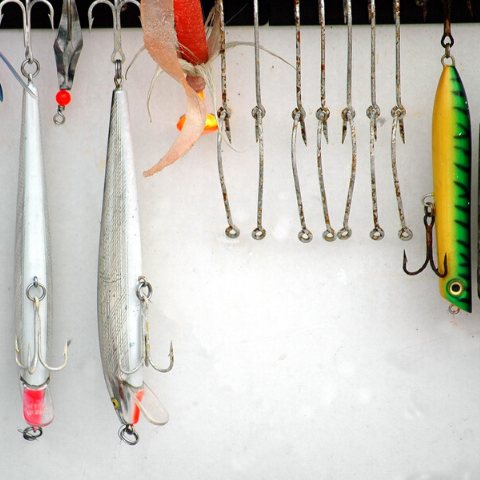 fishing lures hanging from post