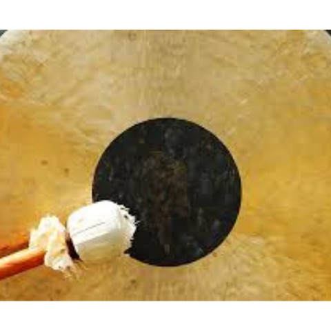 image of a gong being hit by mallet