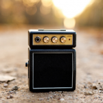 image of a small music amplifier sitting on the road 