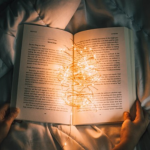 image of book open with string lights in the middle